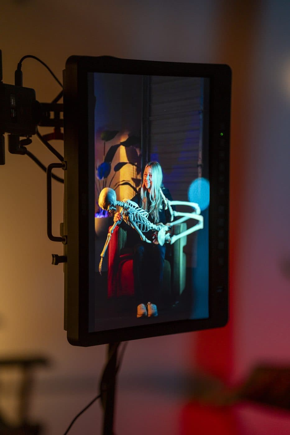 A production monitor displaying graded footage on a Hyped Visuals set, showing the post-production finishing process