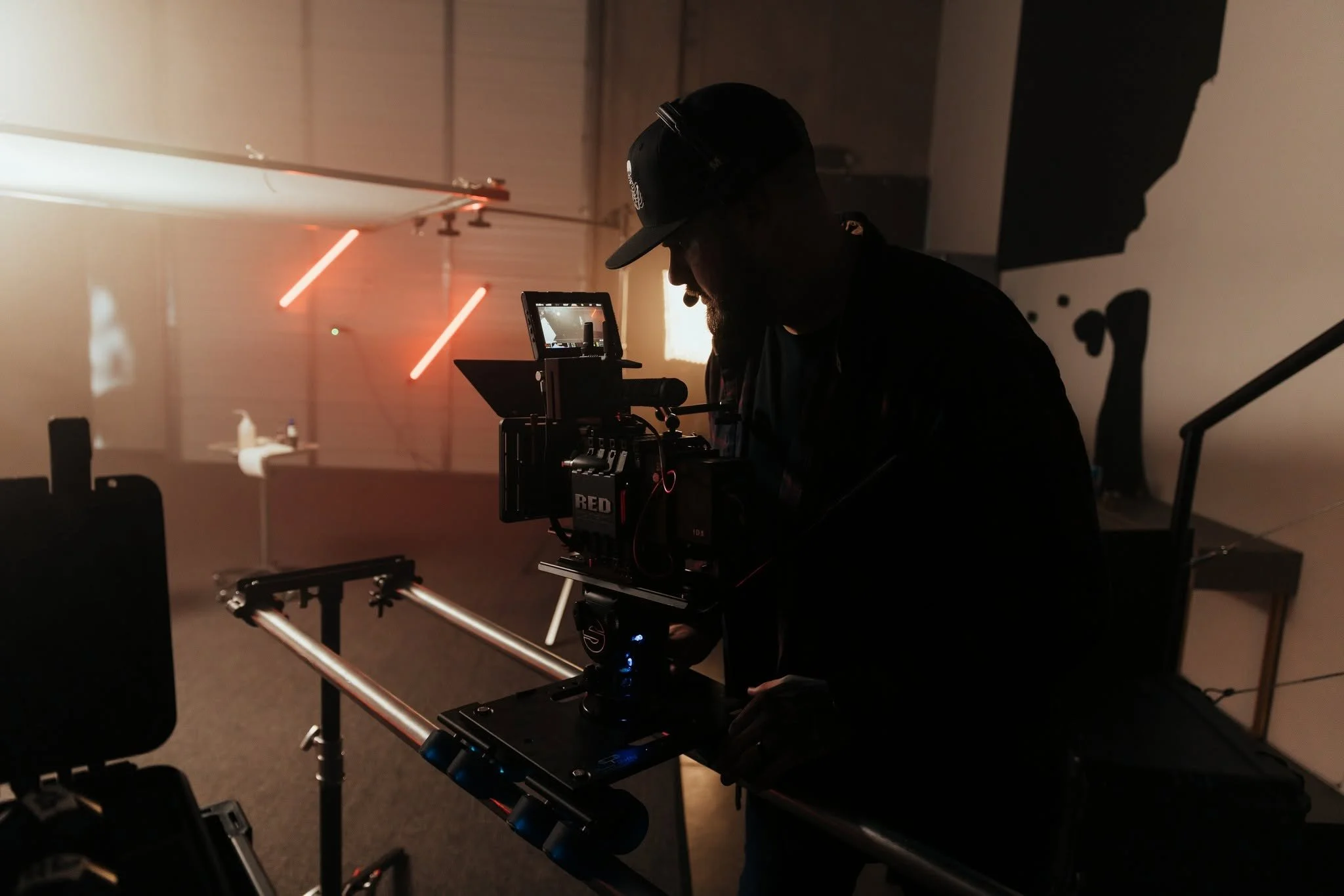 Tyler Maness, founder of Hyped Visuals, operating a camera on an Oklahoma City video production set